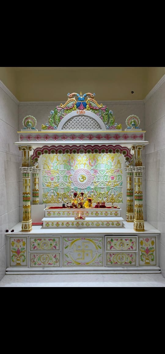 Intricate white marble temple carving detail